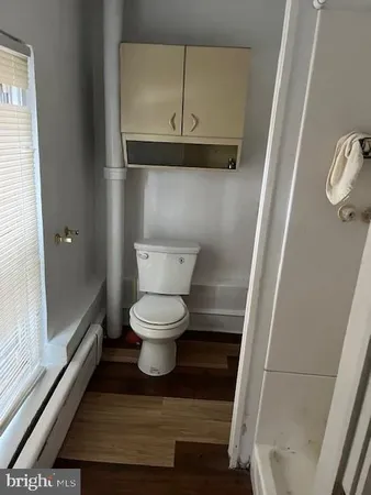 a bathroom with a toilet and a sink