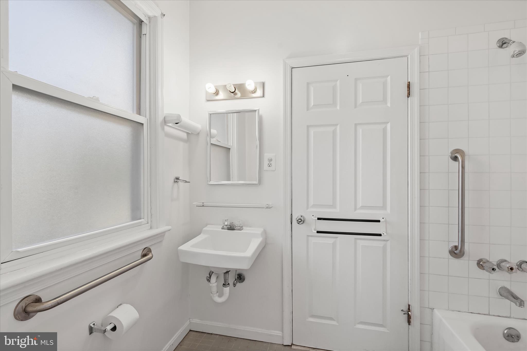 1342 Hamlin Street Northeast Washington, DC 20017 - Photo 15 of 32 a bathroom with a sink a toilet and shower