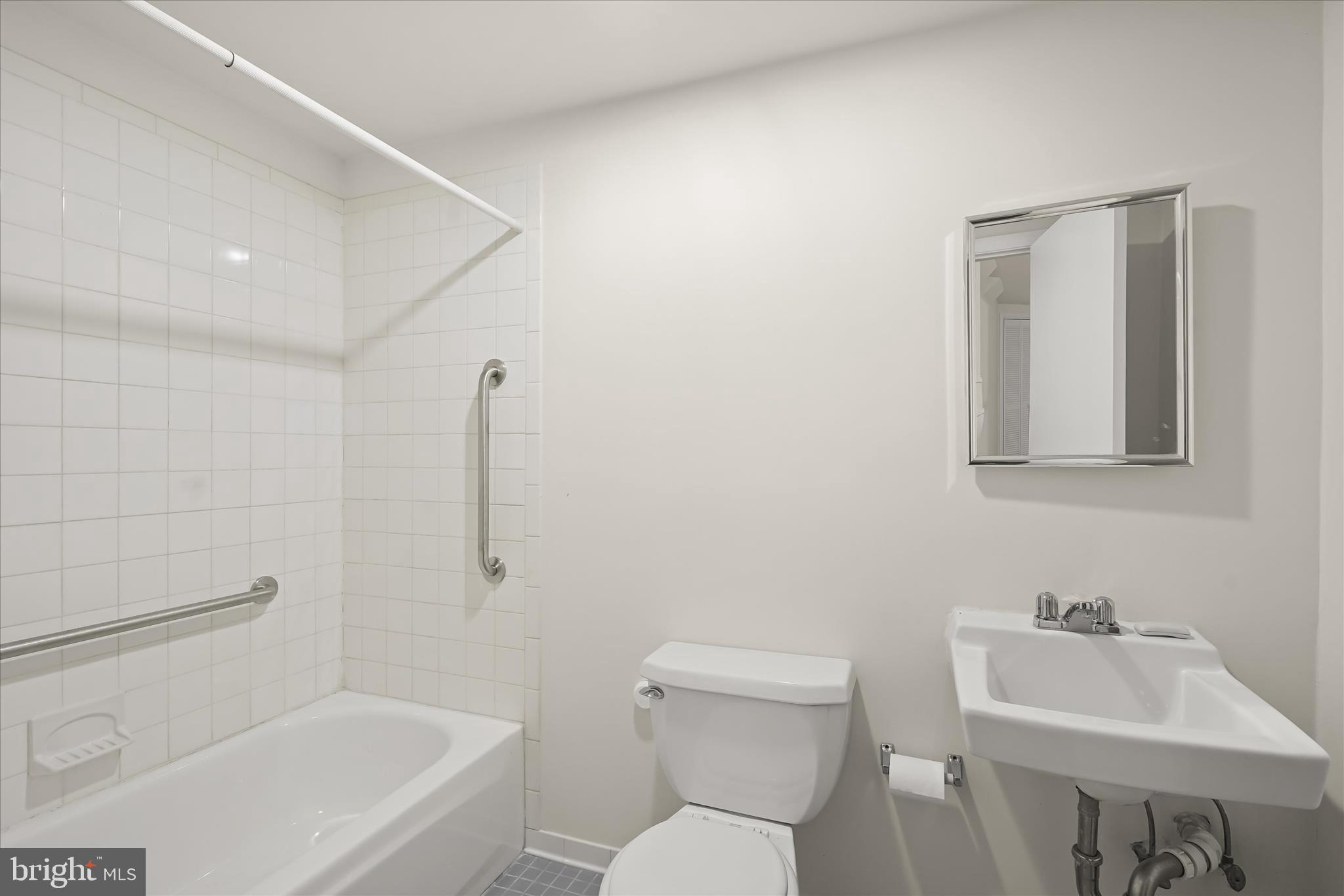 1342 Hamlin Street Northeast Washington, DC 20017 - Photo 21 of 32 a bathroom with a toilet sink and mirror