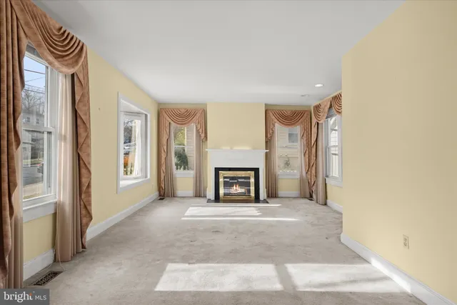 a view of a livingroom with a fireplace