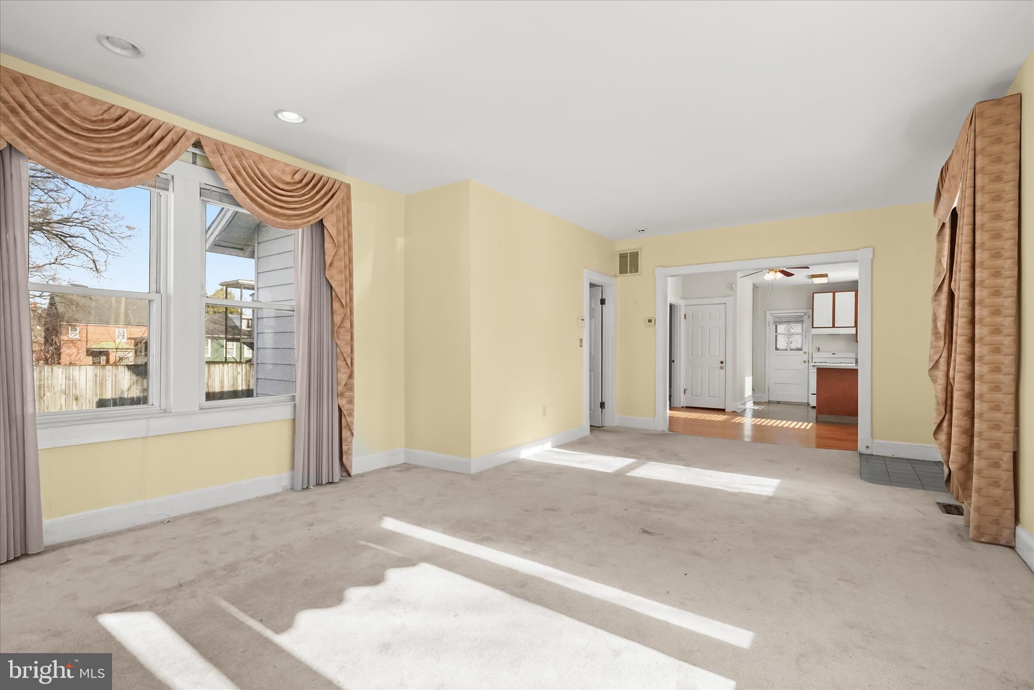 1342 Hamlin Street Northeast Washington, DC 20017 - Photo 5 of 32 a view of a livingroom with wooden floor and a bathroom
