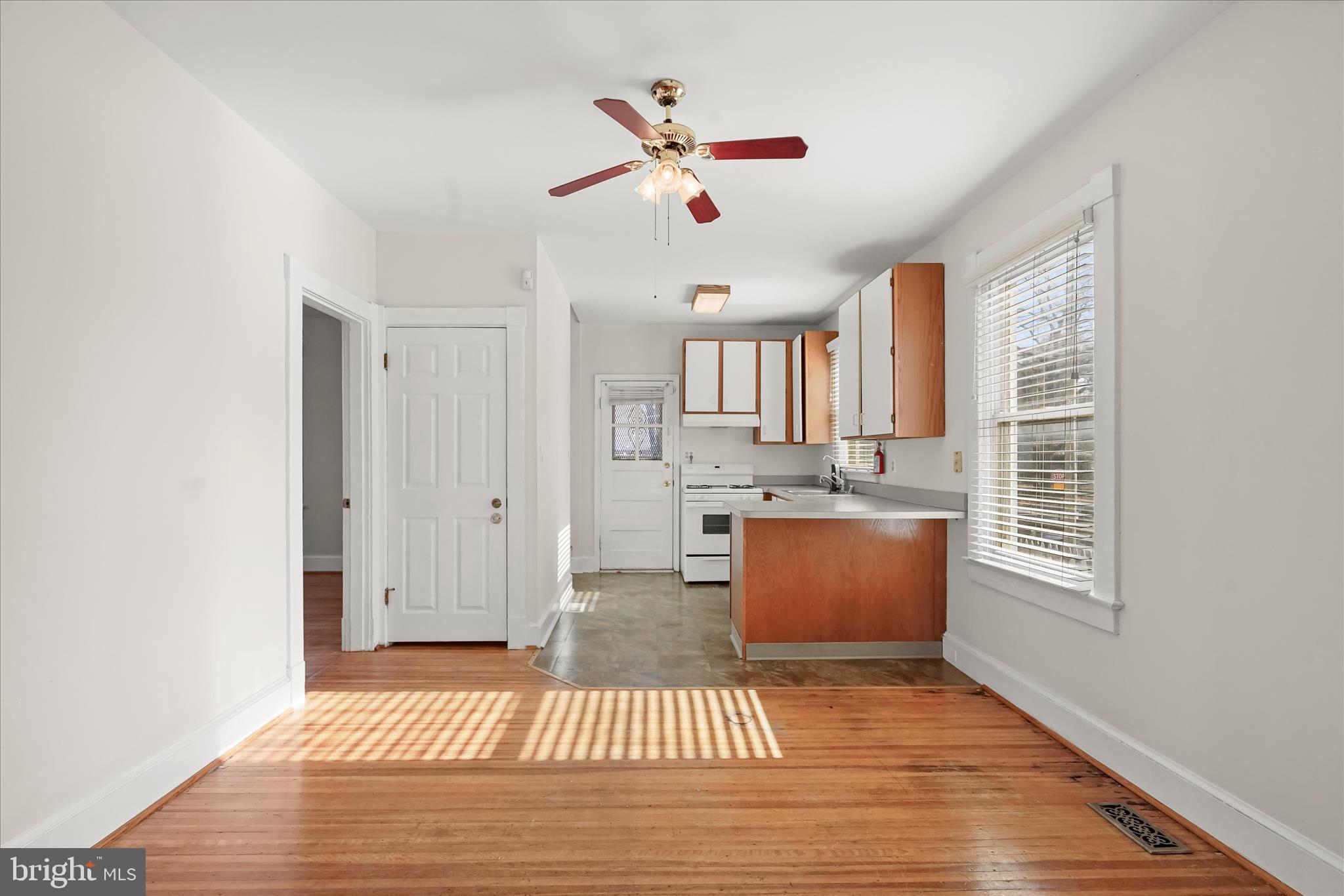 1342 Hamlin Street Northeast Washington, DC 20017 - Photo 7 of 32 a living room with granite countertop furniture a rug and a window