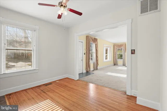 a kitchen with a stove a sink and a window