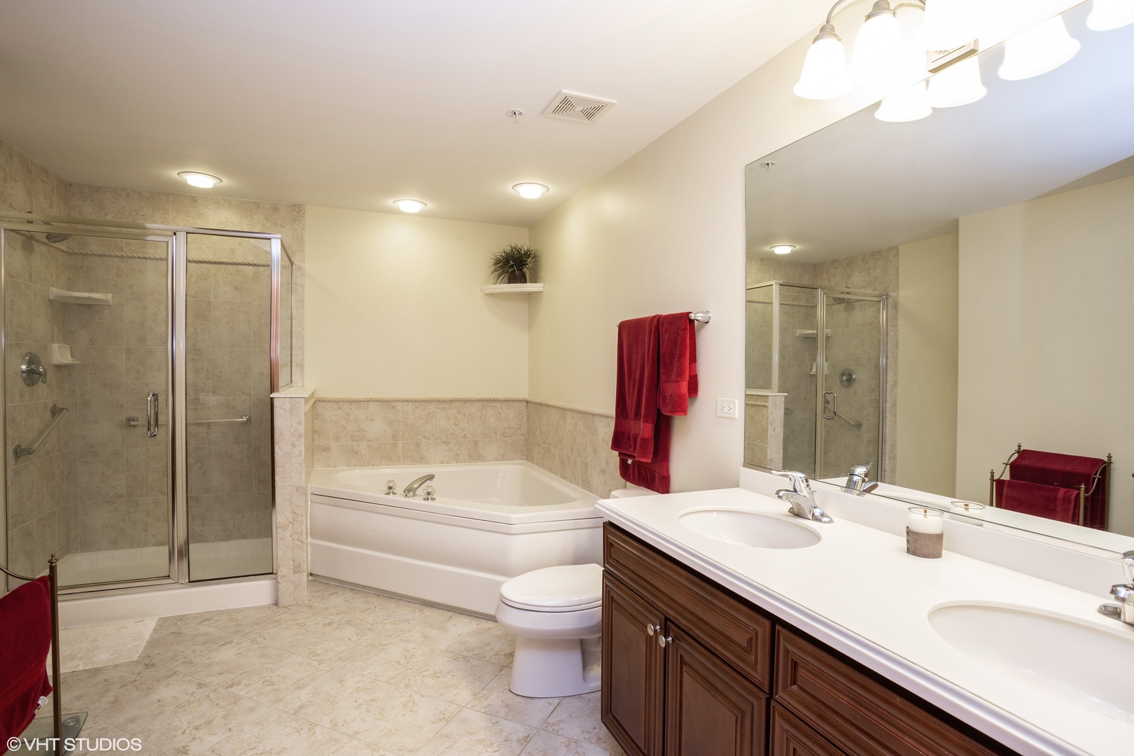 601 West Rand Road, Unit 202A Arlington Heights, IL 60004 - Photo 7 of 10 a bathroom with a sink a toilet and shower