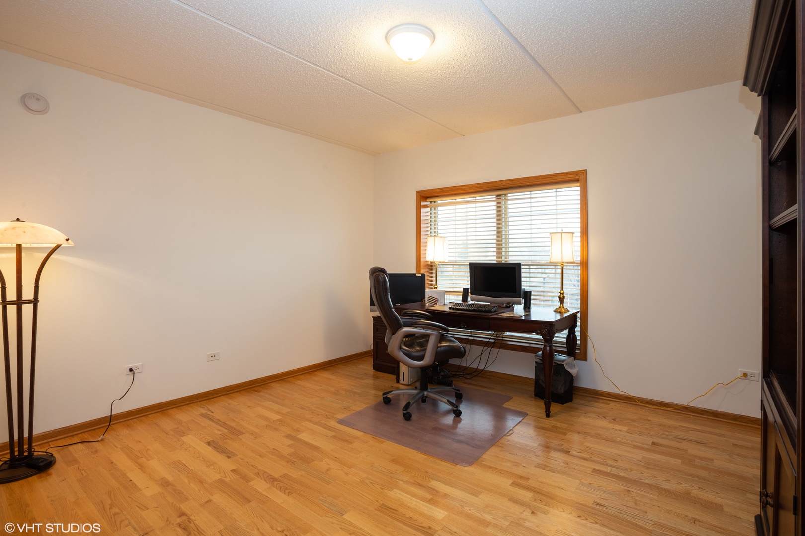 601 West Rand Road, Unit 202A Arlington Heights, IL 60004 - Photo 8 of 10 a view of a workspace with furniture and a window
