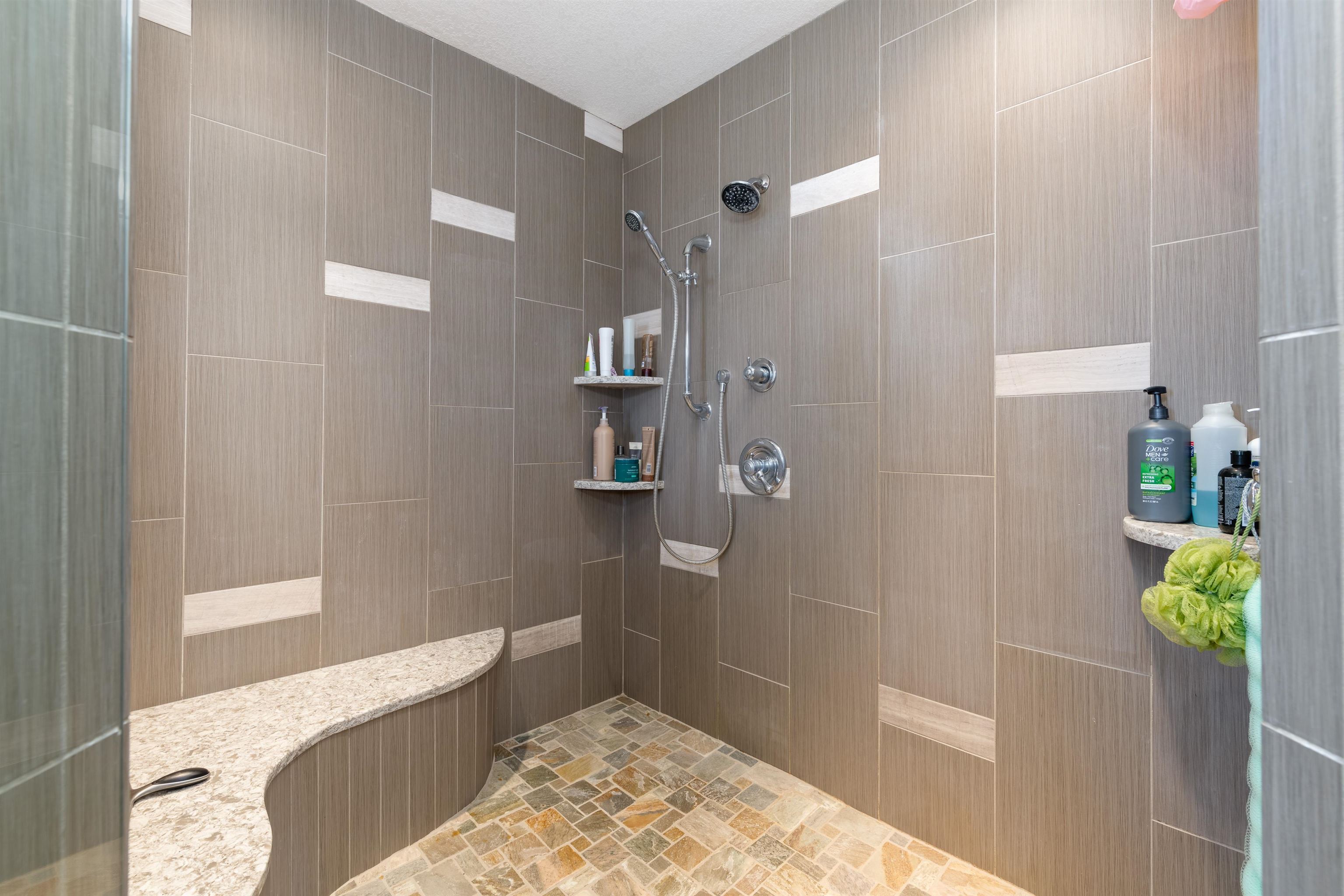 2120 I Road Grand Junction, CO 81505 - Photo 15 of 42 a bathroom with a tub and shower