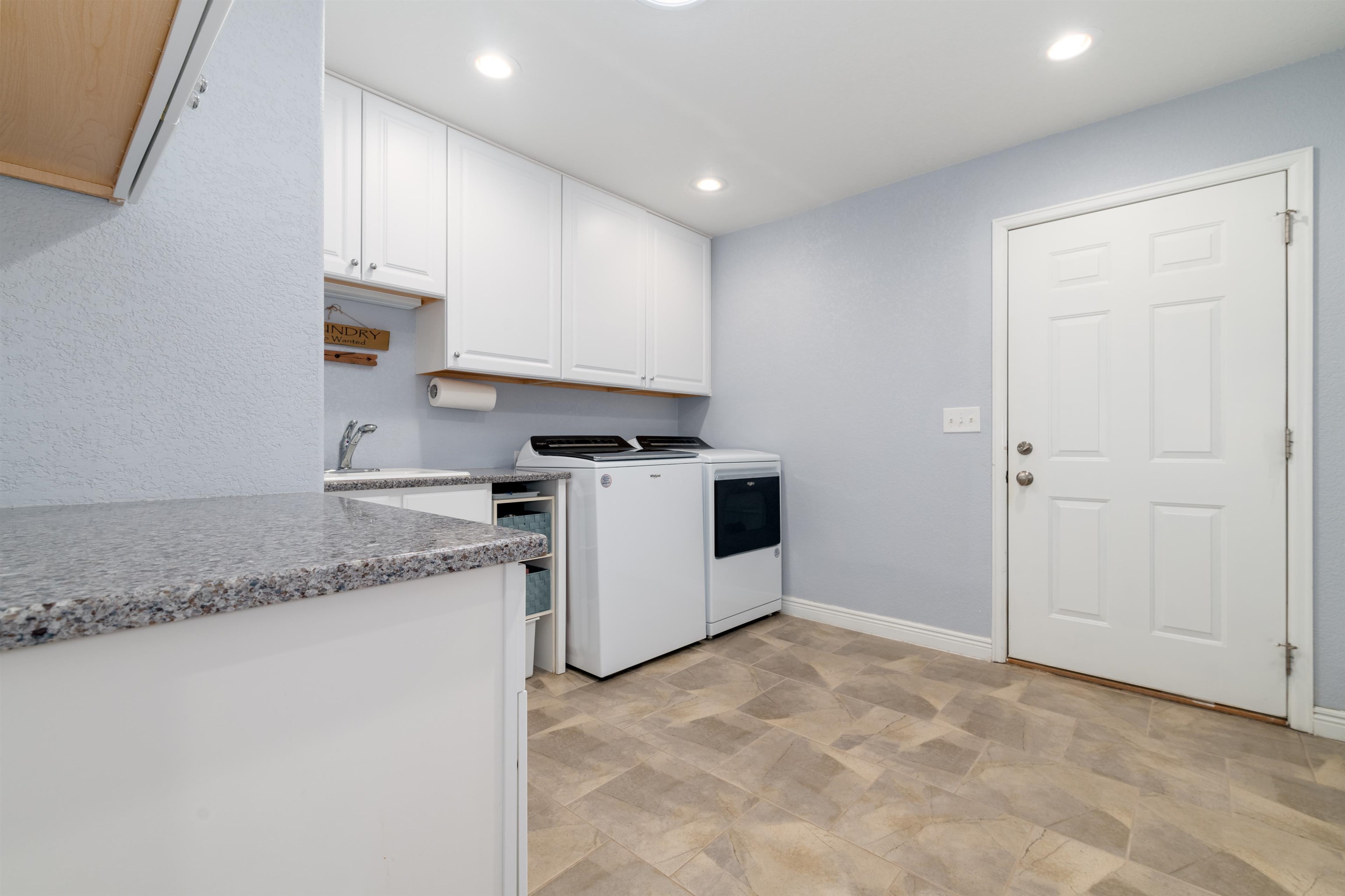 2120 I Road Grand Junction, CO 81505 - Photo 20 of 42 a kitchen with granite countertop white cabinets and white appliances