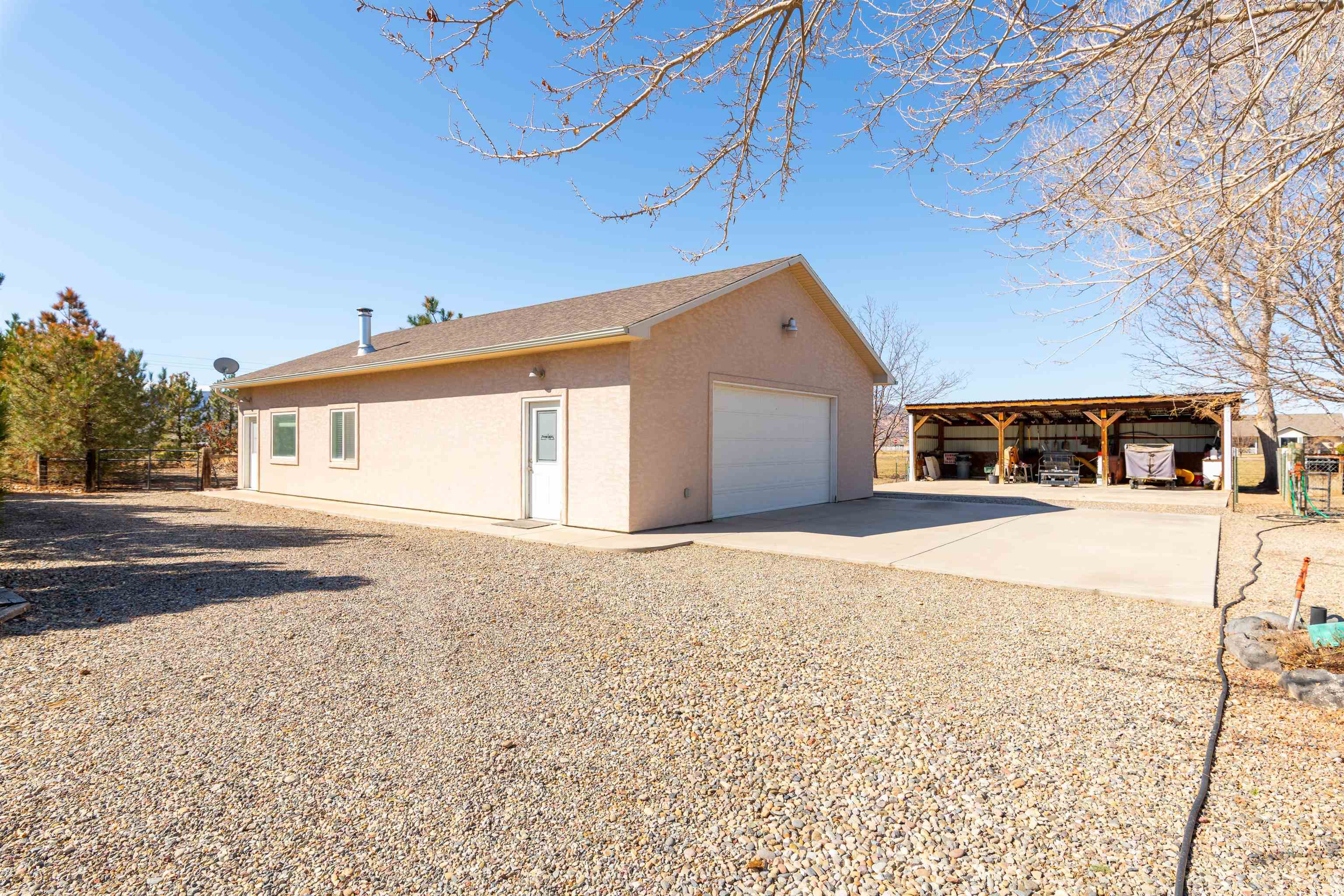 2120 I Road Grand Junction, CO 81505 - Photo 21 of 42 a house with yard in front of it