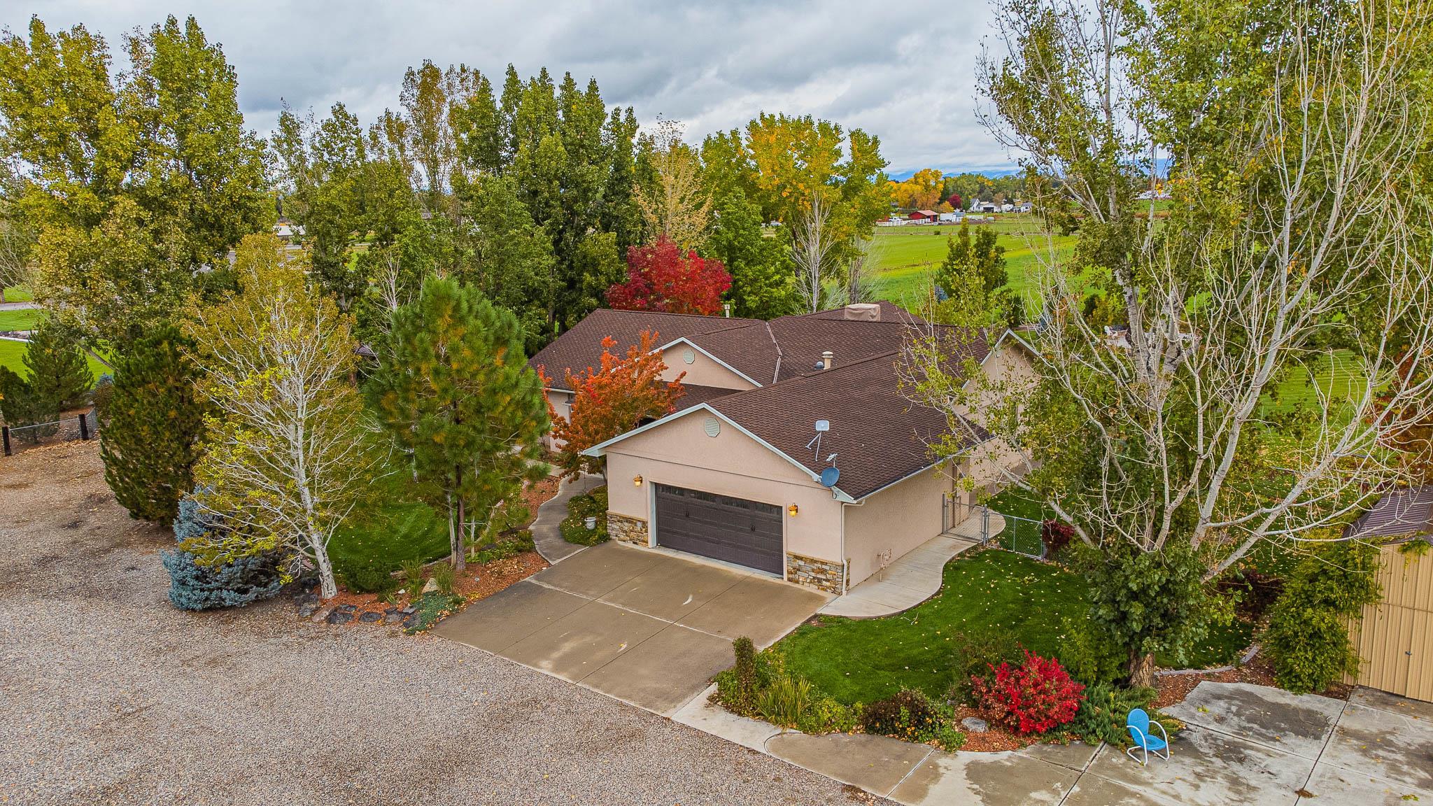 2120 I Road Grand Junction, CO 81505 - Photo 38 of 42 front view of a house with a tree