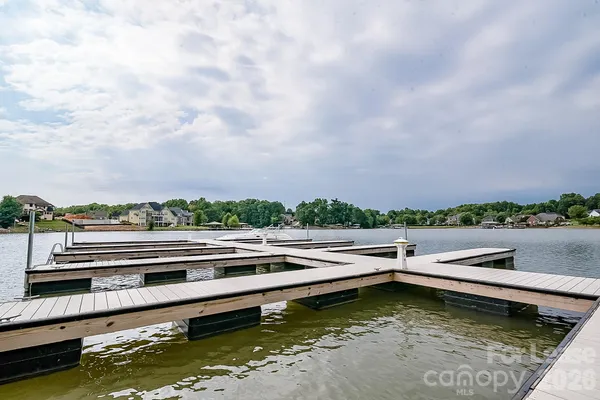 a view of a lake with a house in the background