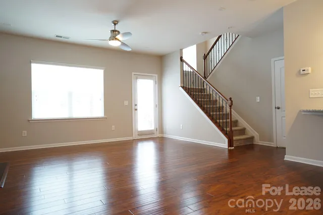 a view of an entryway with wooden floor