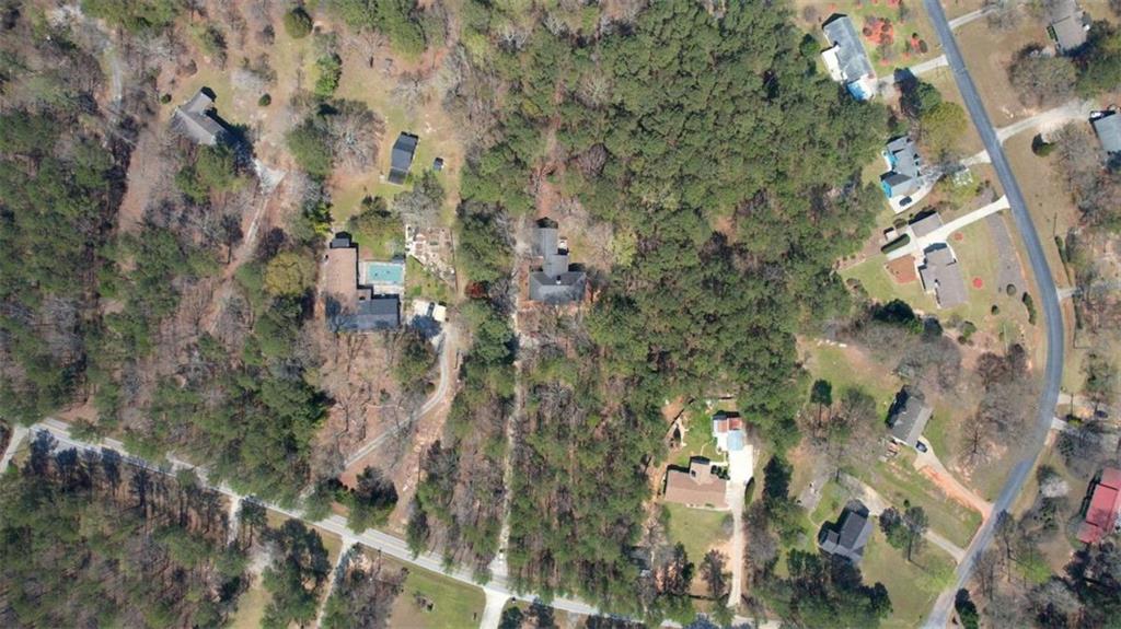2740 Dennard Road Northeast Conyers, GA 30013 - Photo 48 of 51 an aerial view of residential houses with outdoor space