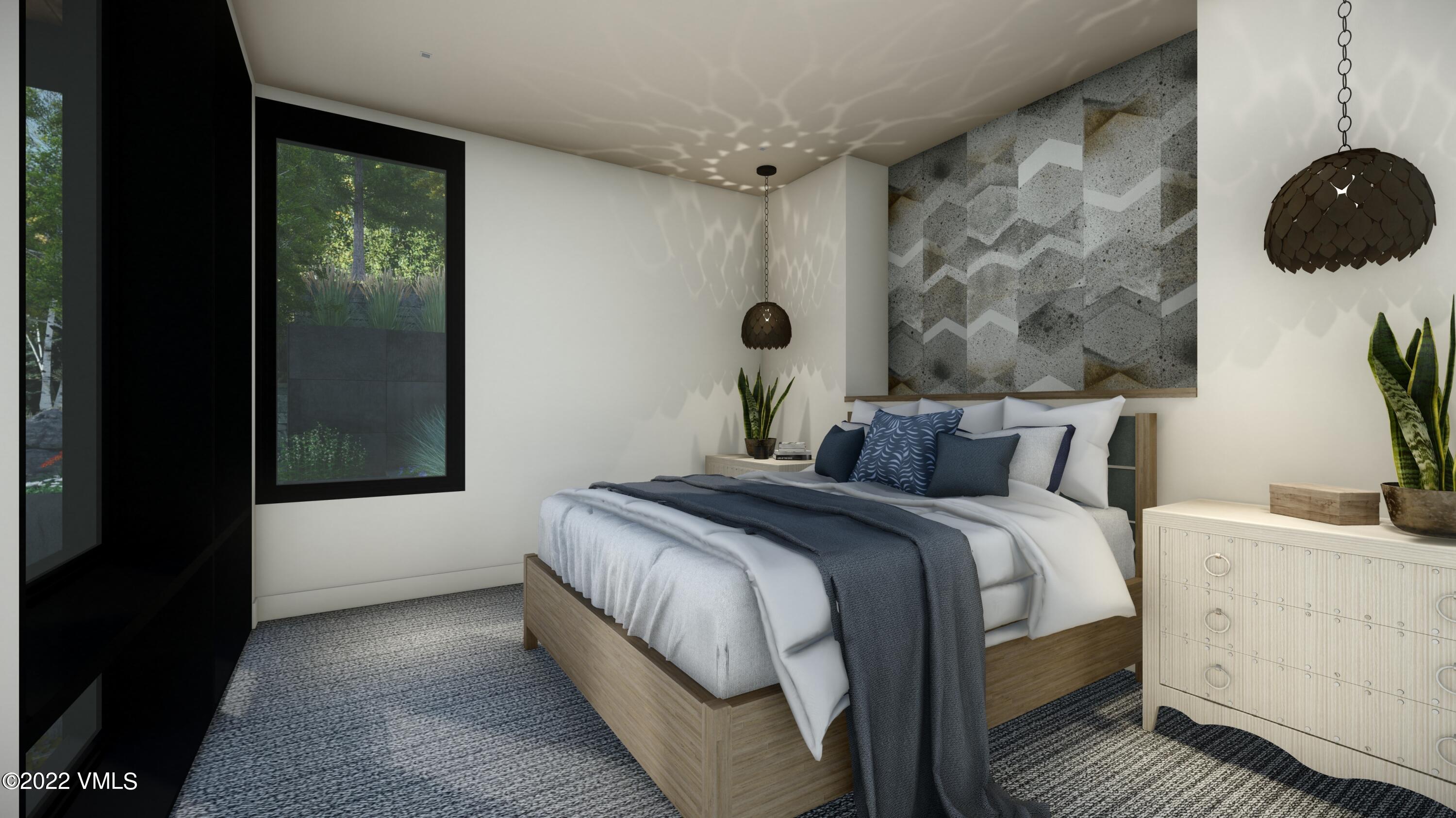 2965 Manns Ranch Road Vail, CO 81657 - Photo 12 of 26 a bedroom with a bed and a window