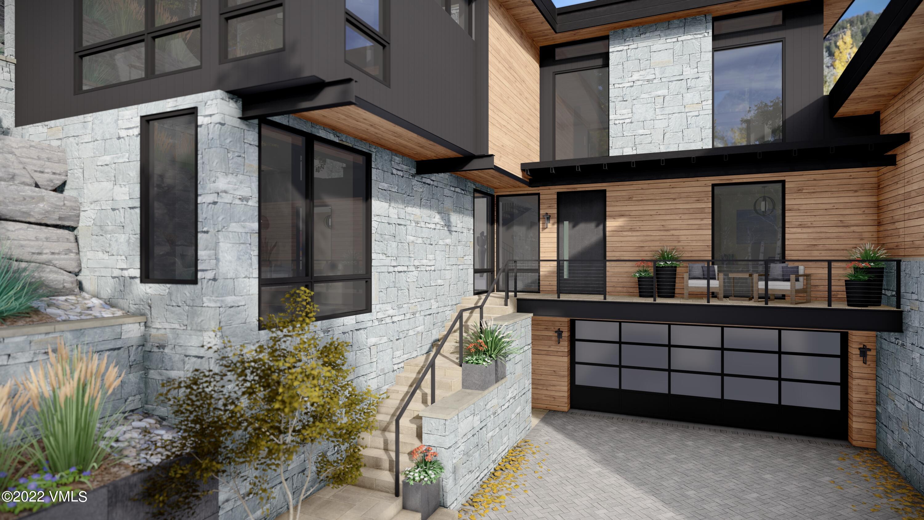 2965 Manns Ranch Road Vail, CO 81657 - Photo 21 of 26 a view of a white house with large windows and potted plants