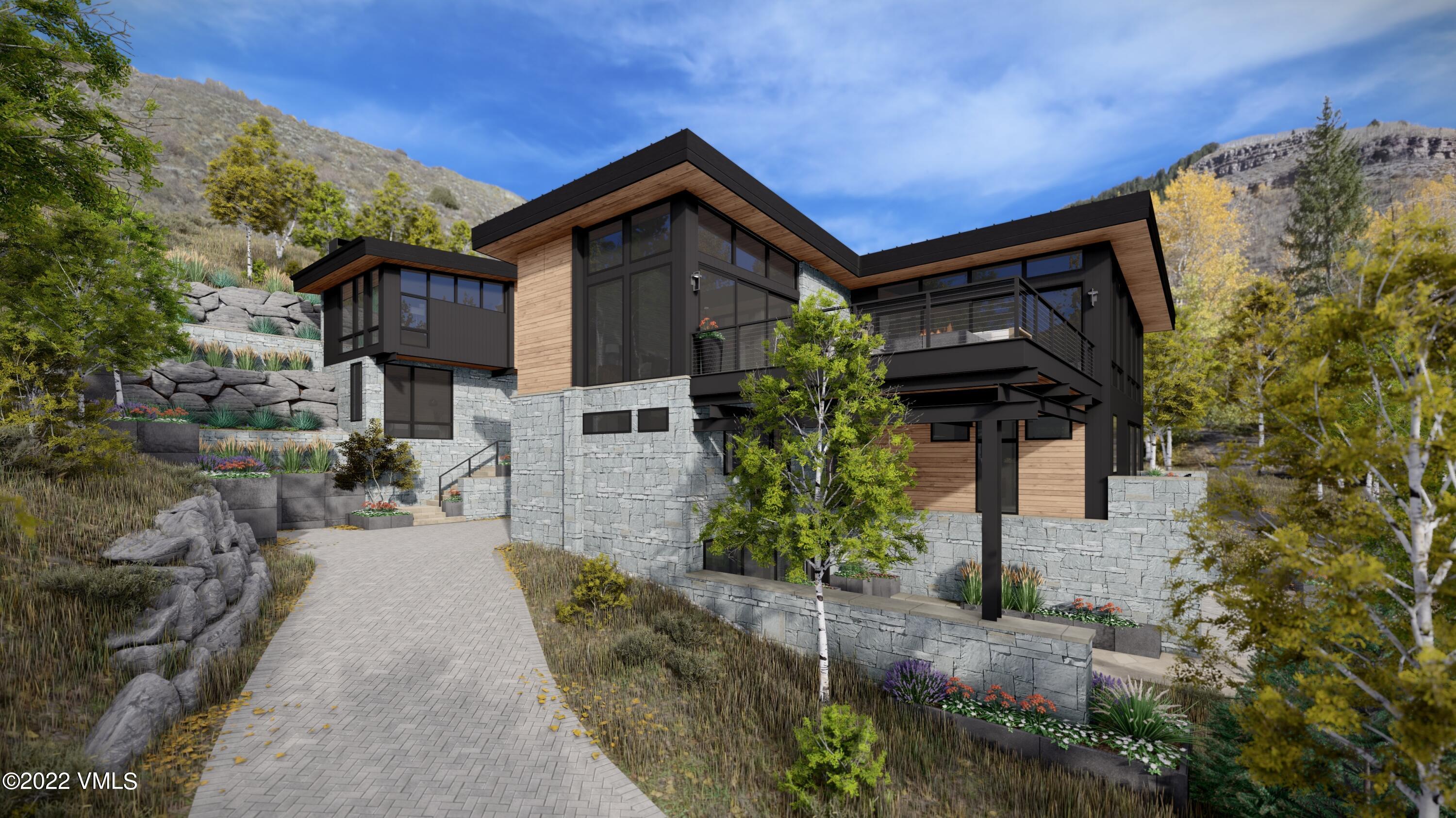 2965 Manns Ranch Road Vail, CO 81657 - Photo 23 of 26 a front view of a house with garden