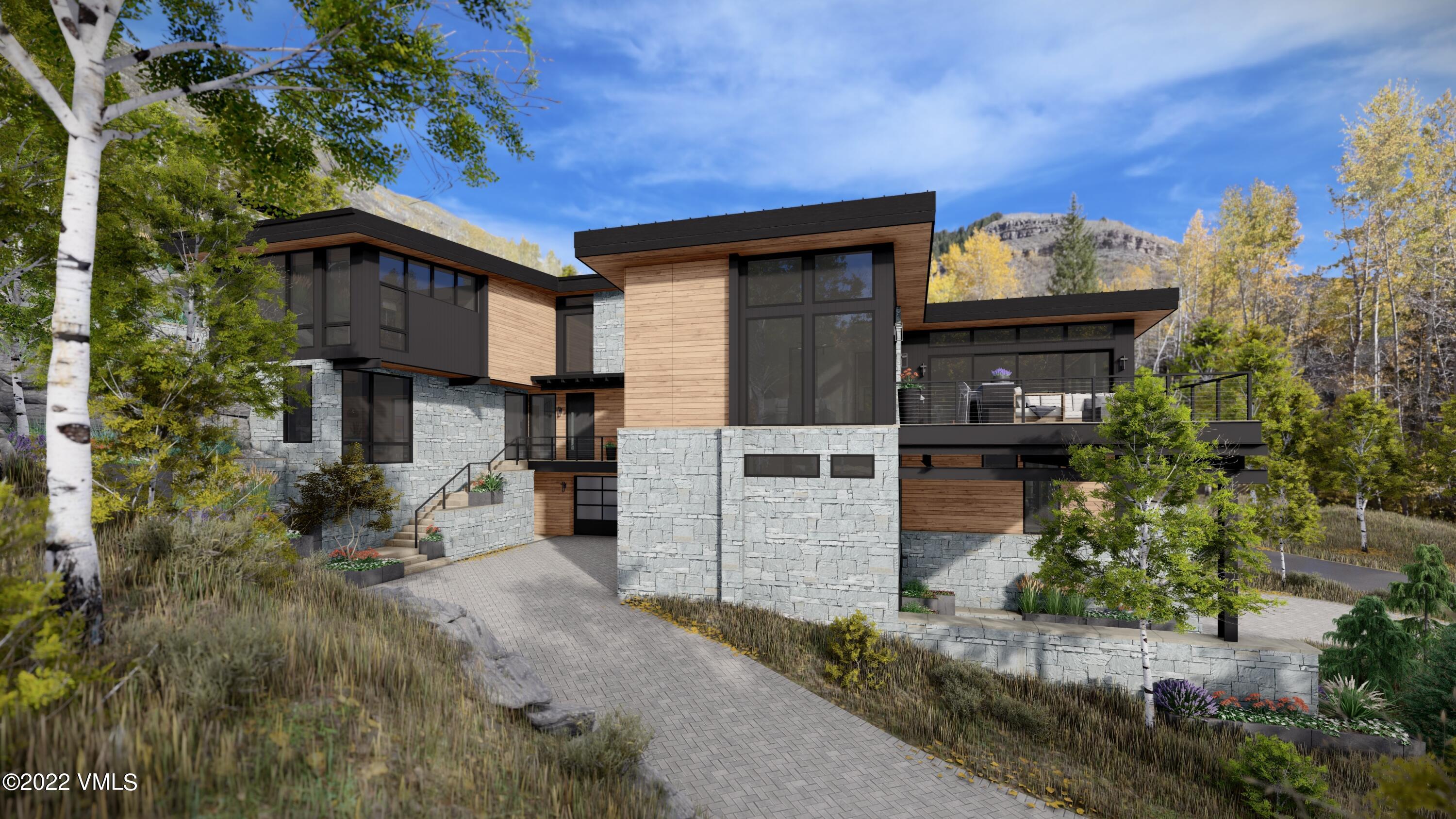 2965 Manns Ranch Road Vail, CO 81657 - Photo 3 of 26 a house that has a tree in front of it