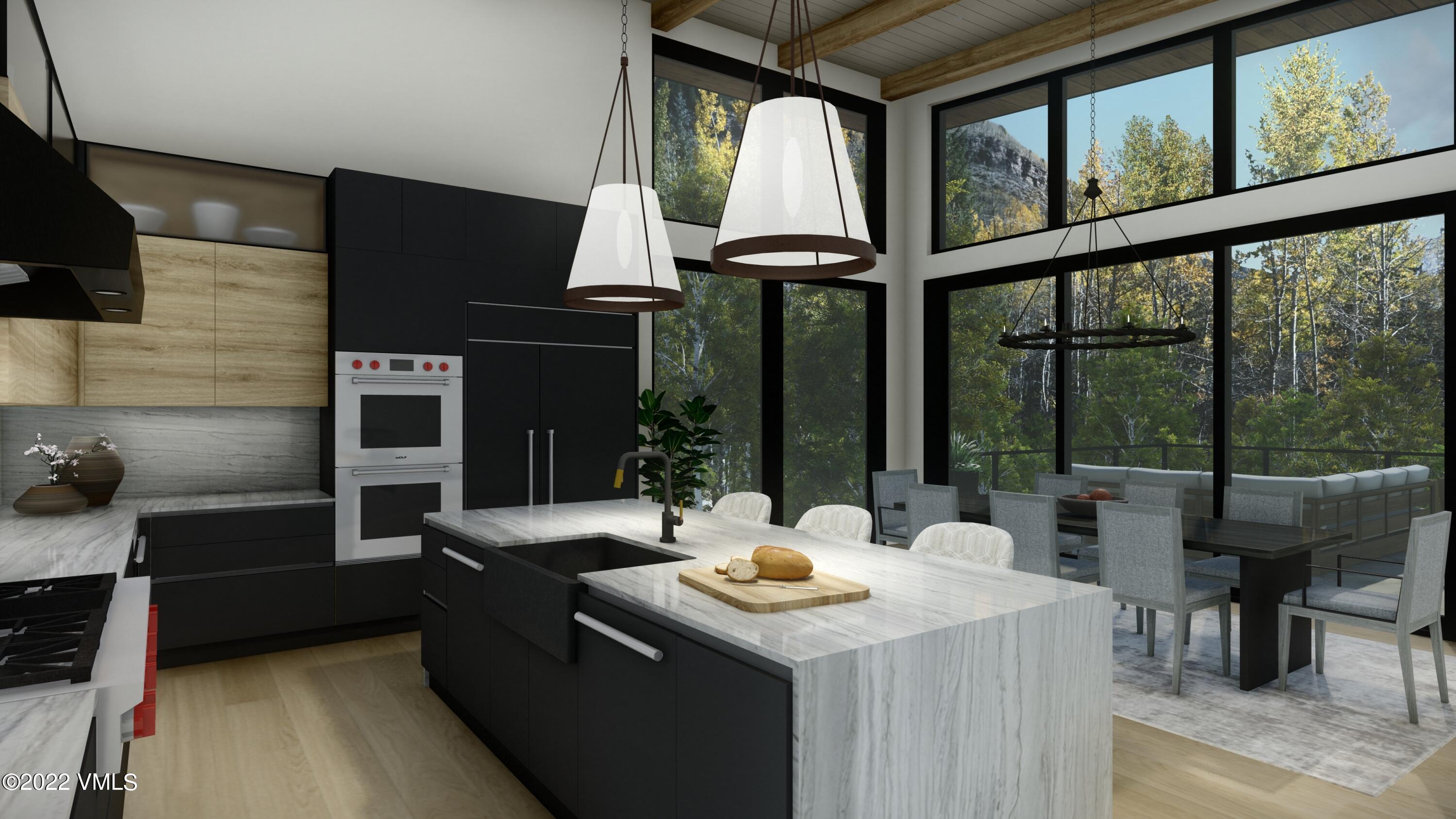 2965 Manns Ranch Road Vail, CO 81657 - Photo 5 of 26 a kitchen with a stove a sink and a dining table with garden view