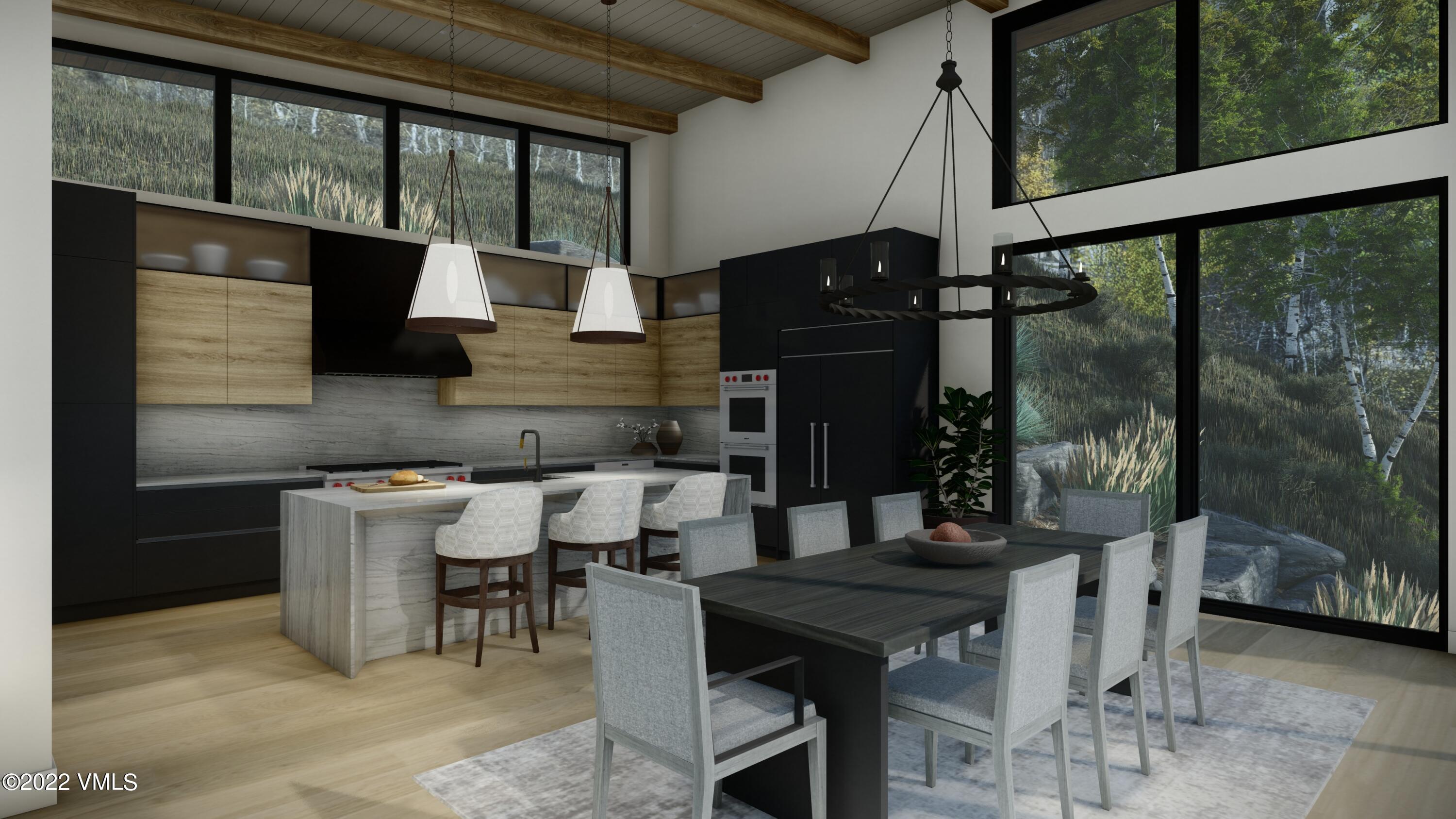 2965 Manns Ranch Road Vail, CO 81657 - Photo 6 of 26 a living room with a table chairs and a floor to ceiling window