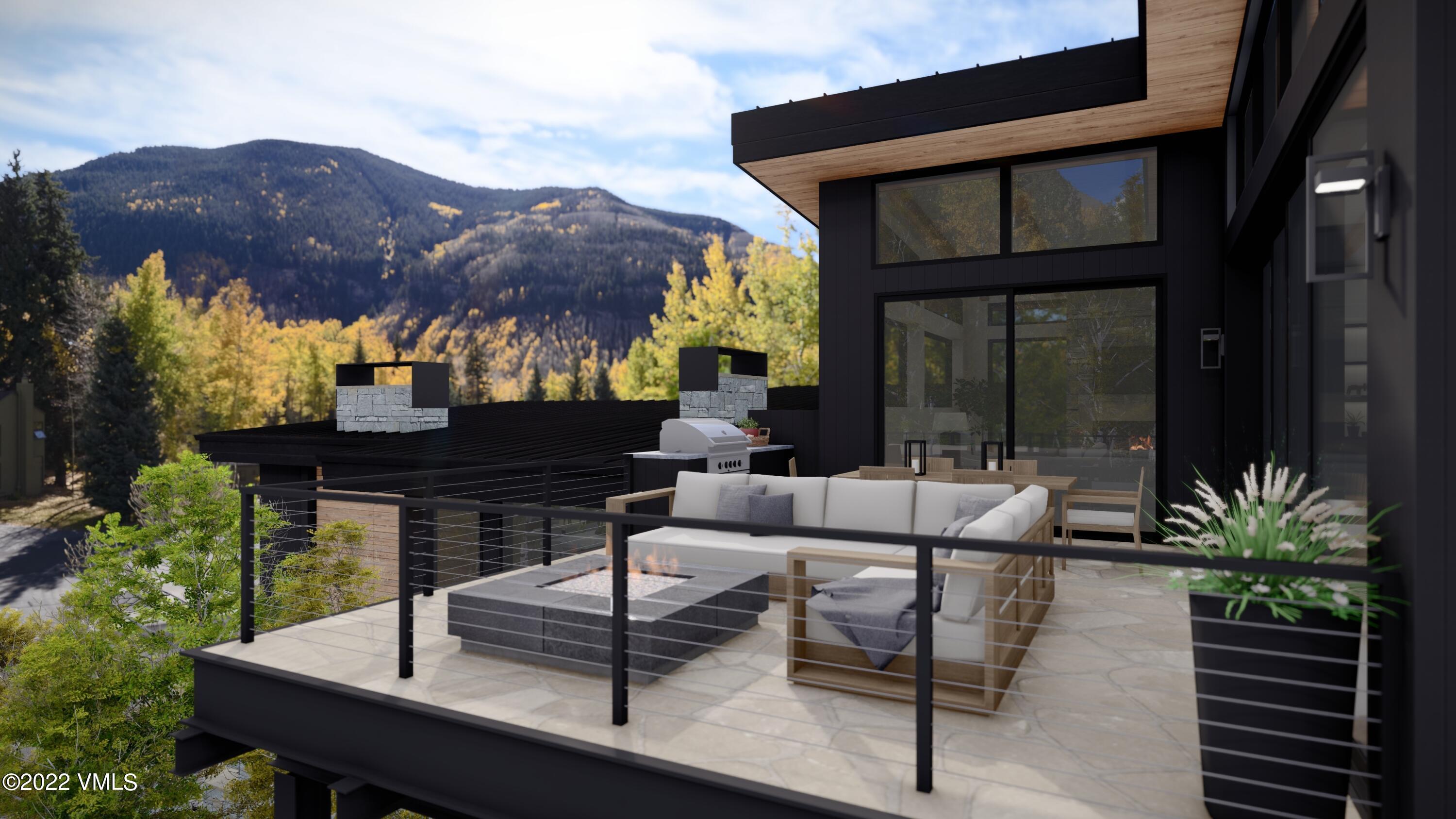 2965 Manns Ranch Road Vail, CO 81657 - Photo 7 of 26 a view of a house with backyard and sitting area