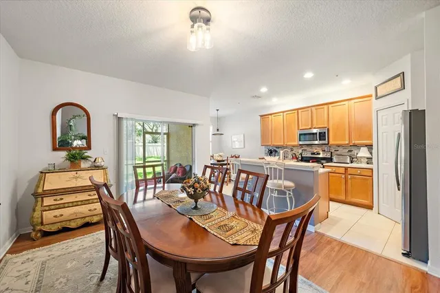 a dining room with furniture and window