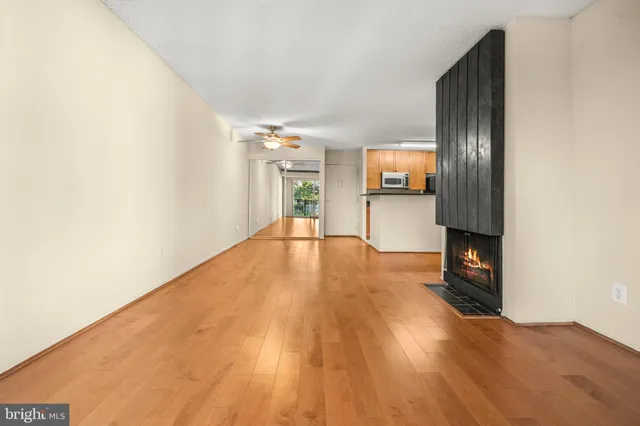 a view of livingroom with hardwood floor and a ceiling fan