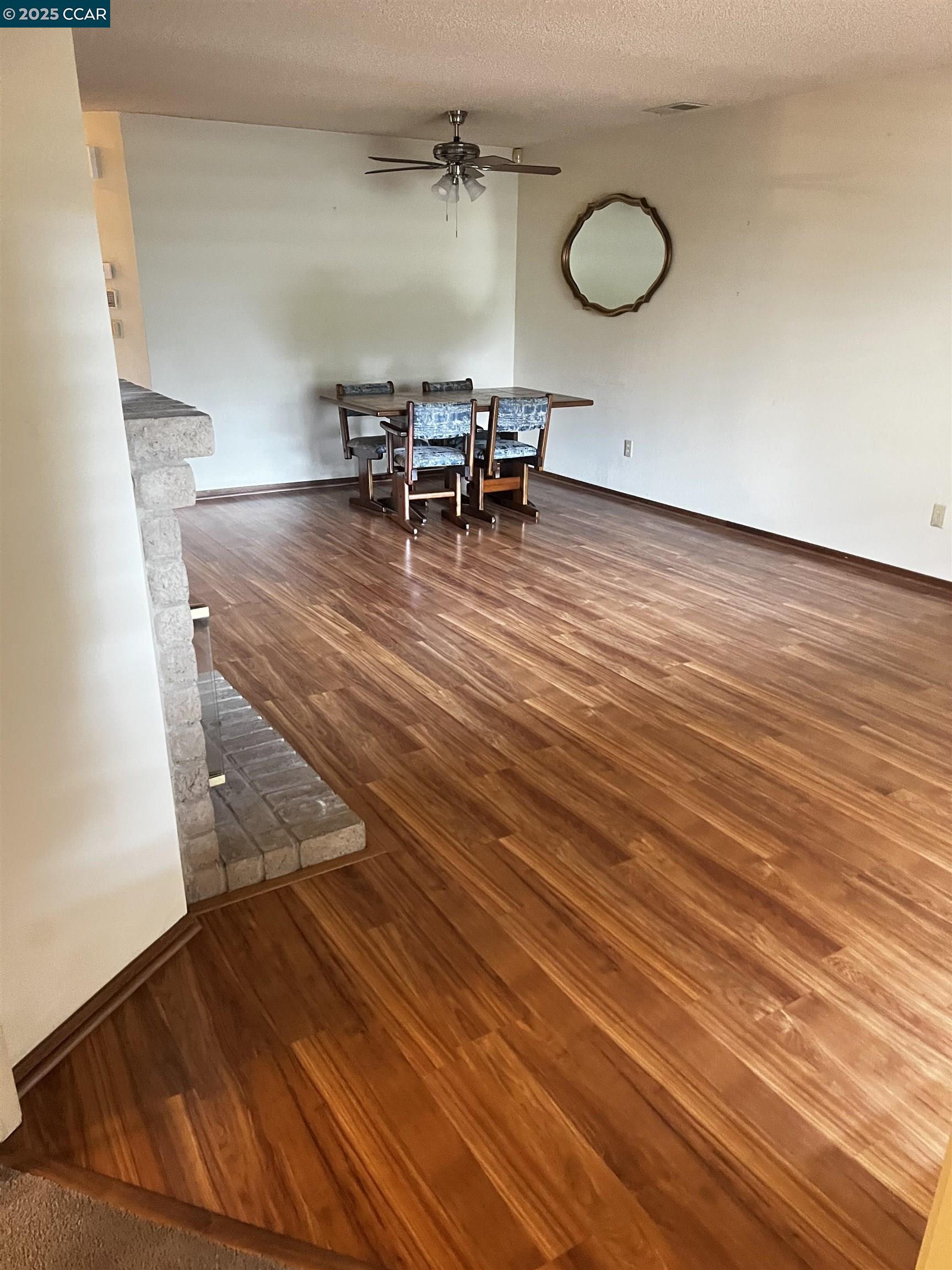 309 Devonwood Hercules, CA 94547 - Photo 19 of 26 an empty room with wooden floor and chairs