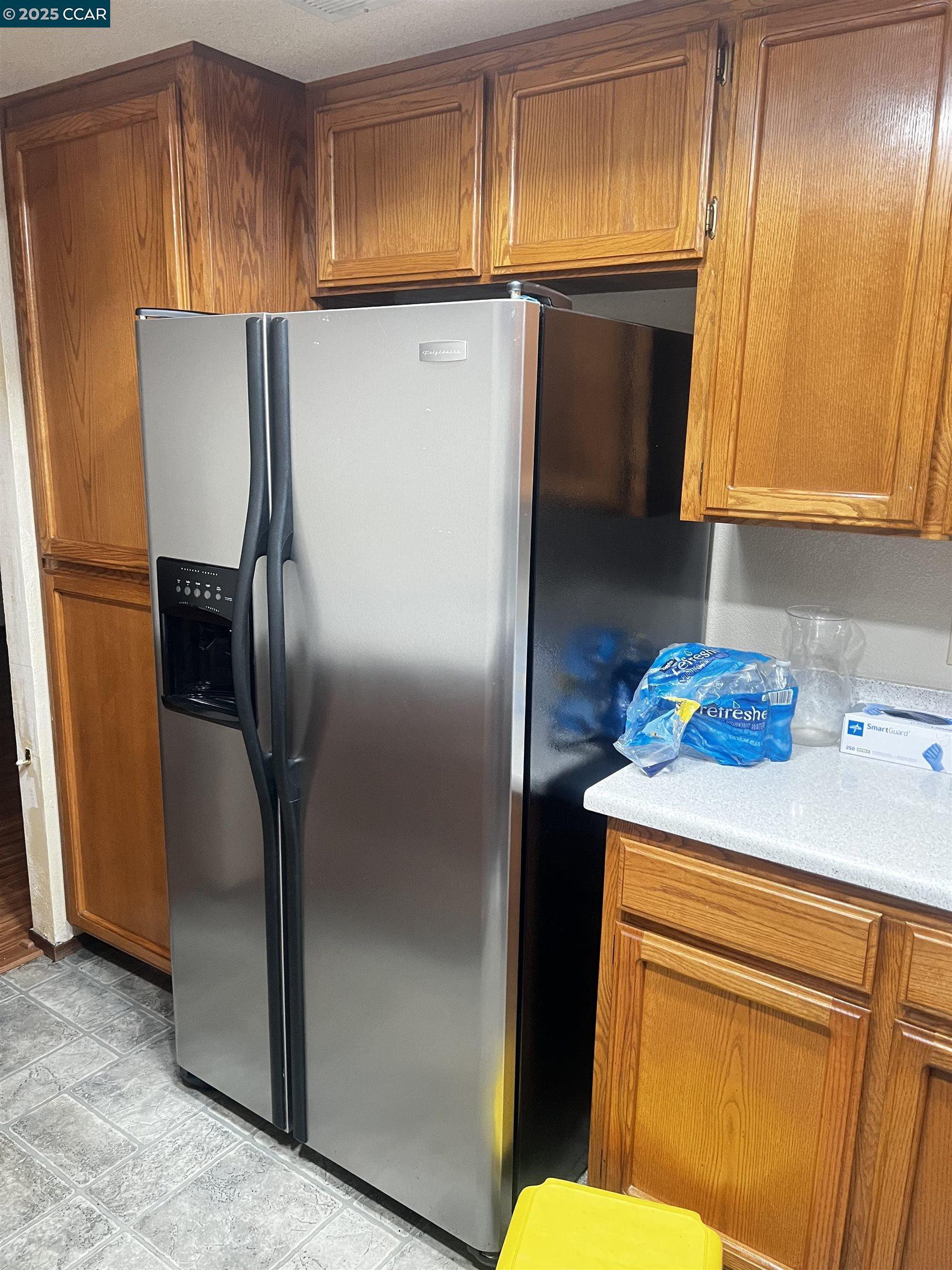 309 Devonwood Hercules, CA 94547 - Photo 24 of 26 a kitchen with stainless steel appliances a refrigerator and a sink
