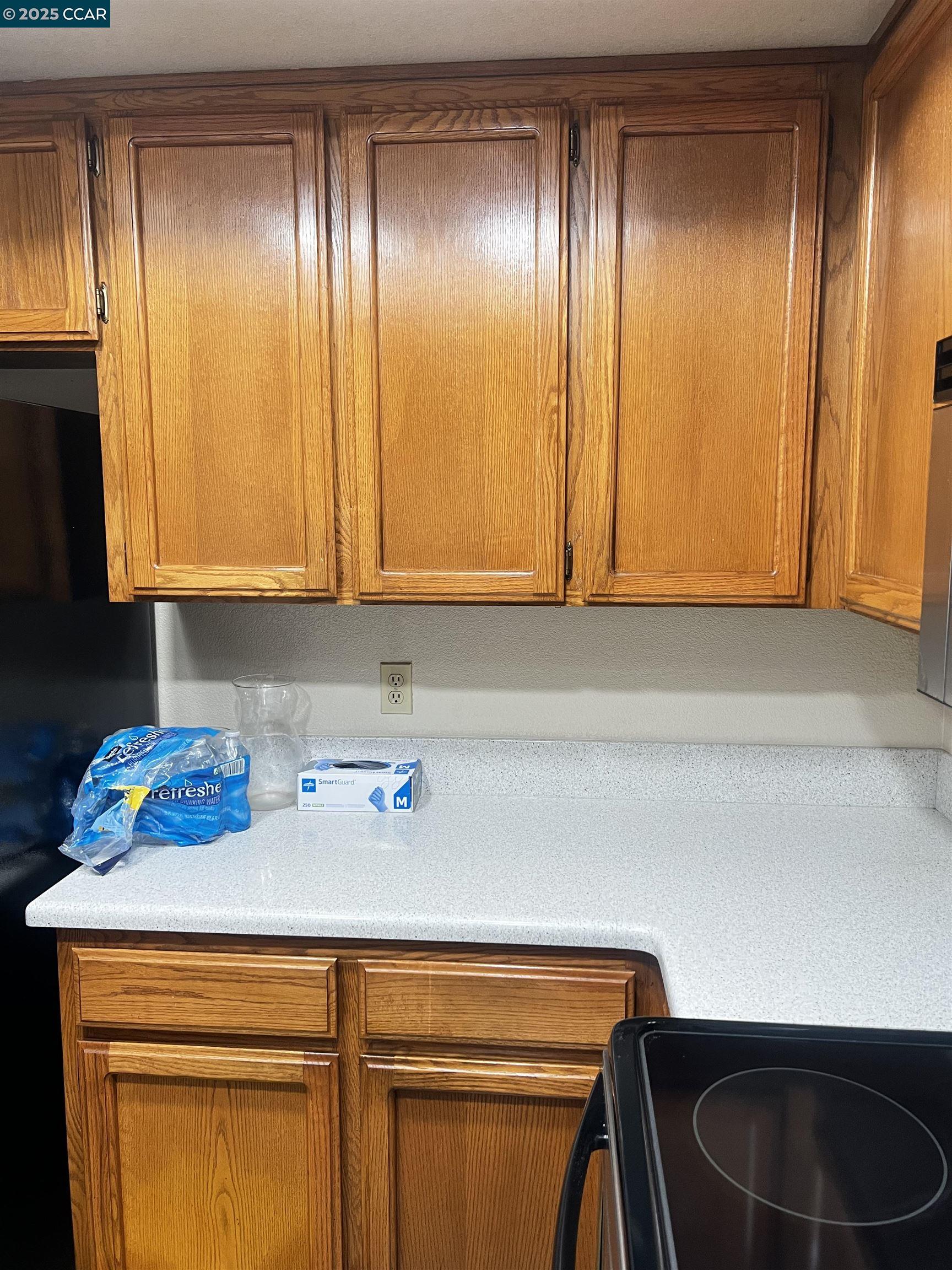 309 Devonwood Hercules, CA 94547 - Photo 25 of 26 a kitchen with a sink cabinets and appliances