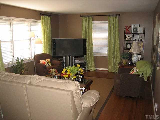 3535 Brentwood Road Raleigh, NC 27604 - Photo 2 of 12 a living room with furniture and a flat screen tv