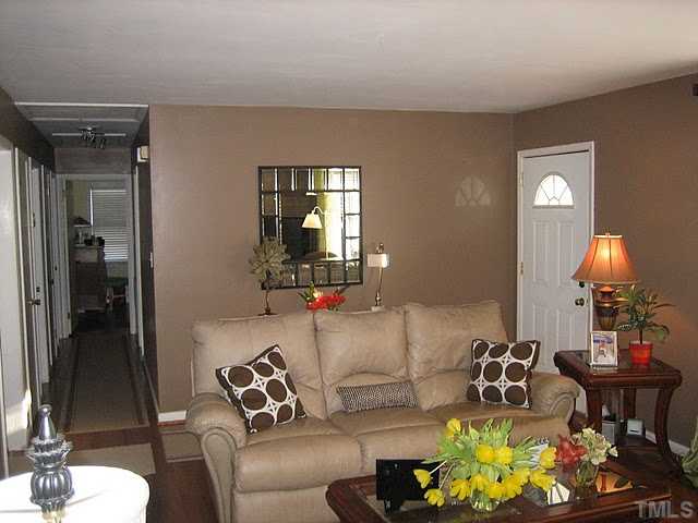 3535 Brentwood Road Raleigh, NC 27604 - Photo 3 of 12 a living room with furniture and a chandelier