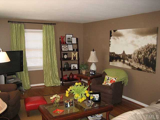 3535 Brentwood Road Raleigh, NC 27604 - Photo 4 of 12 a living room with furniture and a window