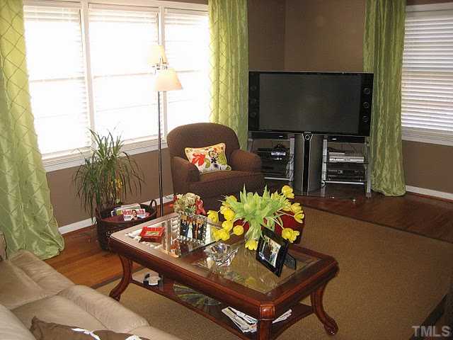 3535 Brentwood Road Raleigh, NC 27604 - Photo 5 of 12 a living room with furniture and a flat screen tv
