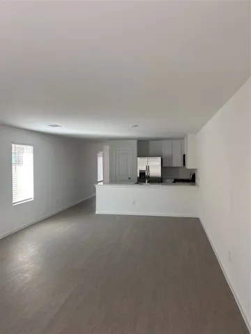 a view of empty room with a fireplace