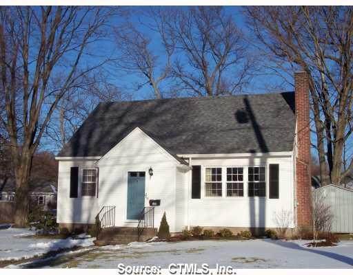 128 Bretton Road Manchester, CT 06042 - Photo 1 of 1 a front view of a house with a yard