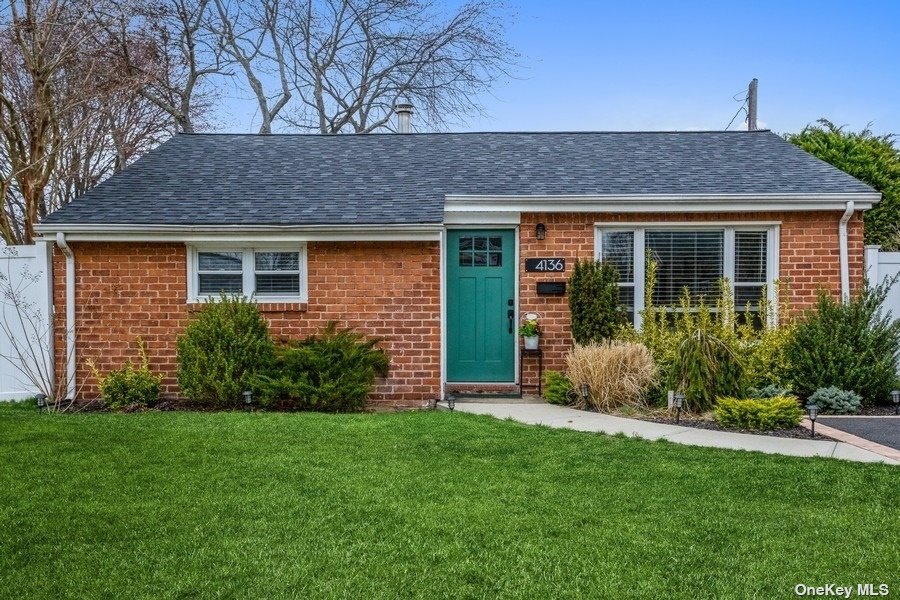 4136 Gloria Road Bethpage, NY 11714 - Photo 1 of 1 a front view of a house with garden