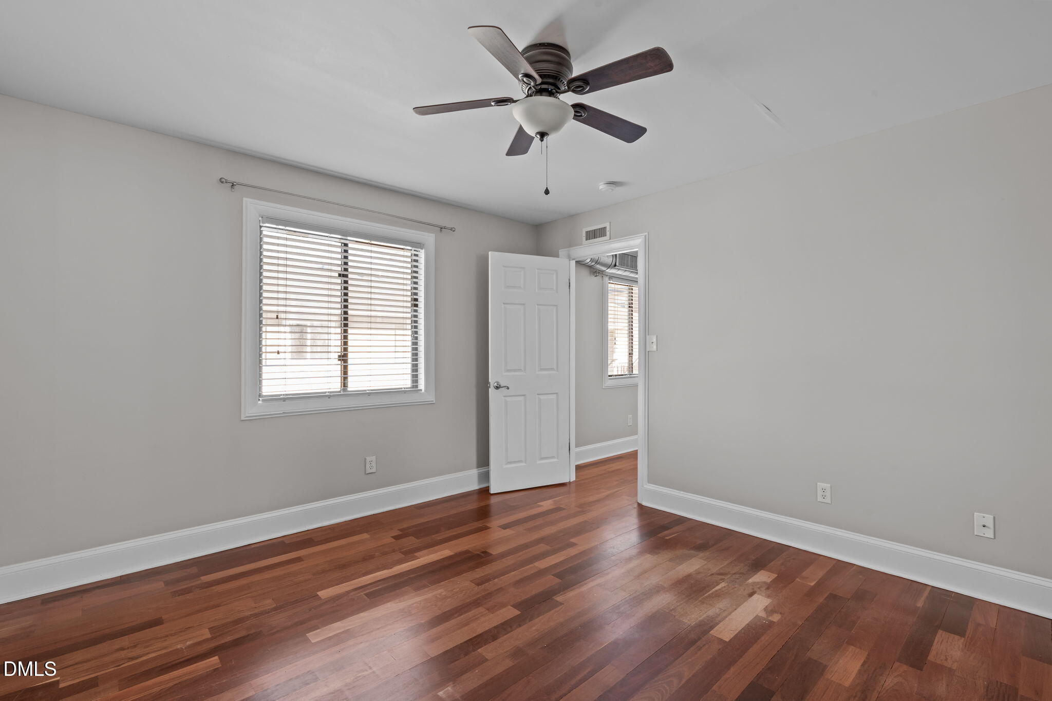 2208 Stafford Avenue Raleigh, NC 27607 - Photo 15 of 30 wooden floor in an empty room with a window