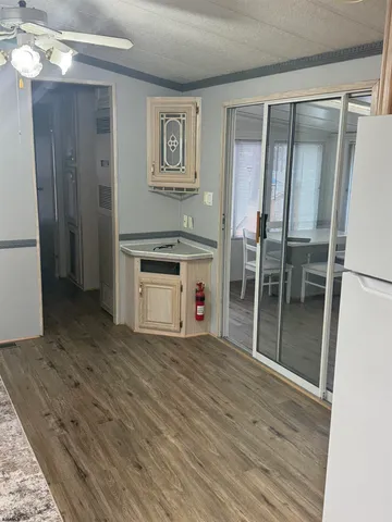 a view of a hallway with a wooden floor