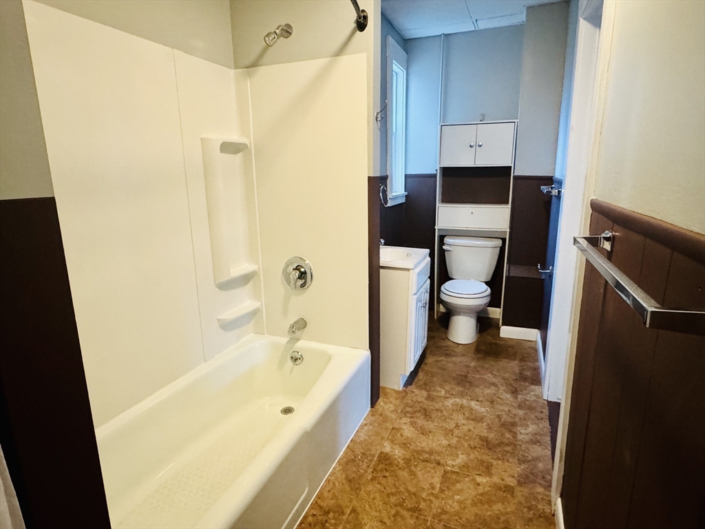 25 Cohasse Street, Unit 2 Southbridge, MA 01550 - Photo 4 of 8 a bathroom with a bathtub and toilet