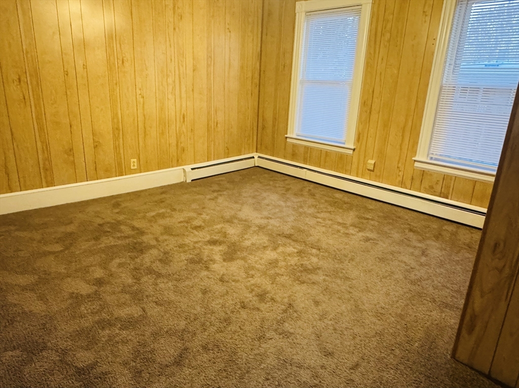 25 Cohasse Street, Unit 2 Southbridge, MA 01550 - Photo 6 of 8 a view of an empty room with window