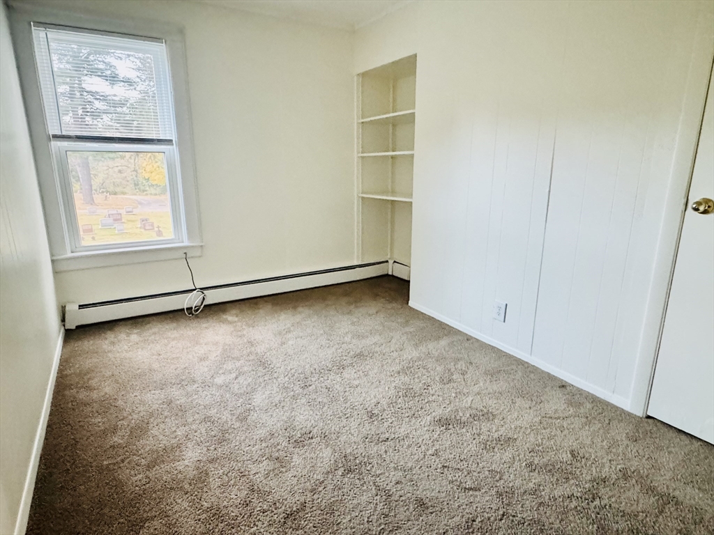 25 Cohasse Street, Unit 2 Southbridge, MA 01550 - Photo 7 of 8 an empty room with windows