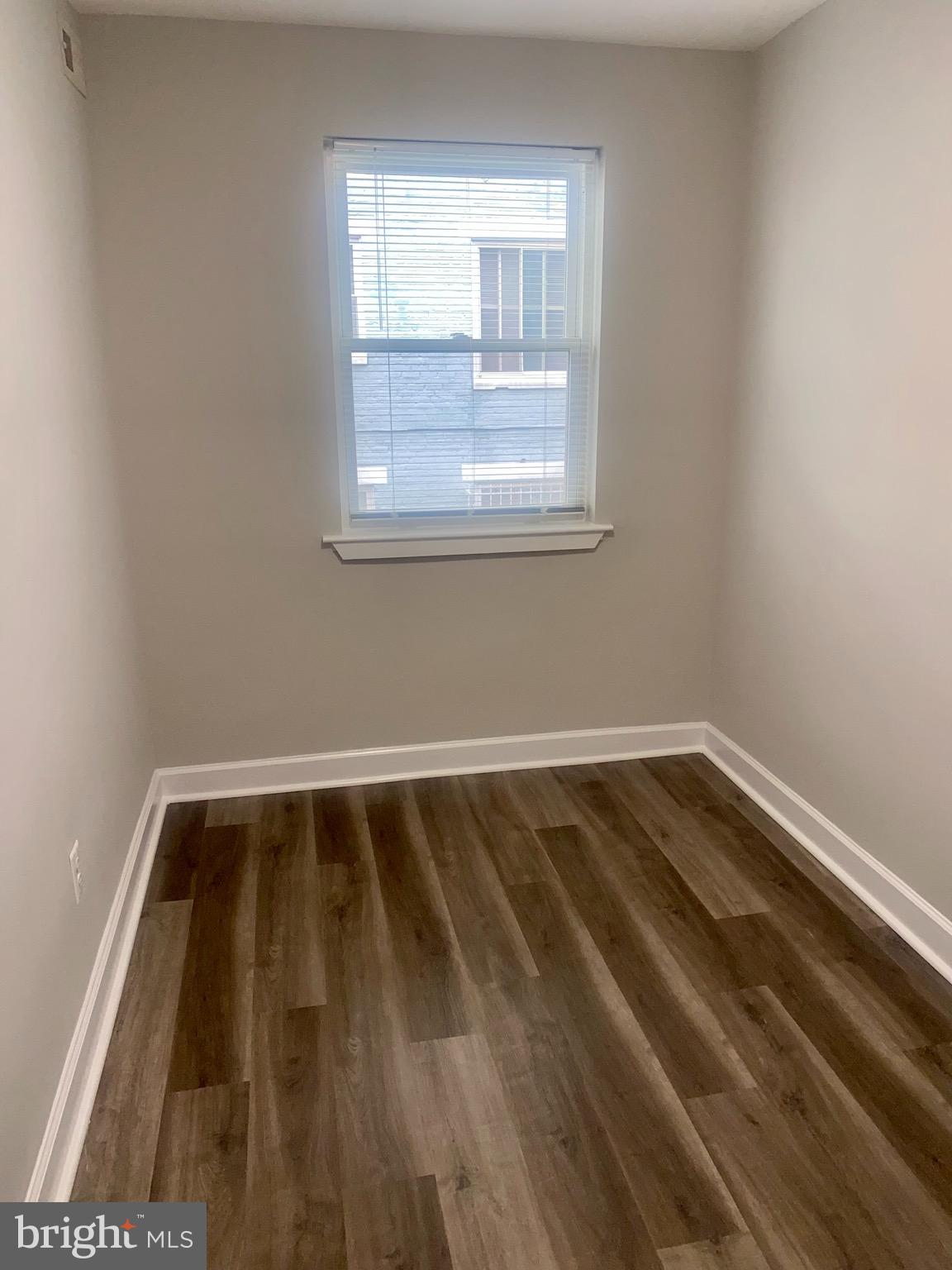 718 Brandywine Street Southeast, Unit 202 Washington, DC 20032 - Photo 5 of 10 a view of wooden floor in a room
