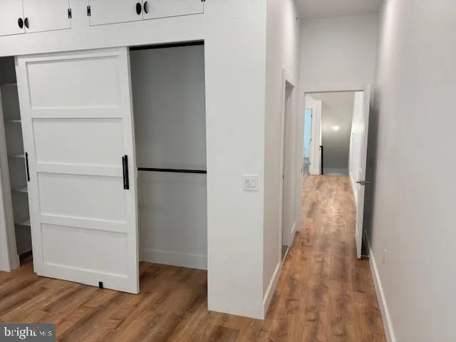 a bathroom with a granite countertop bathtub shower sink vanity and toilet