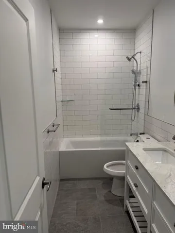 a kitchen with granite countertop a stove and a sink
