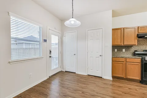 a view of a balcony with wooden floor