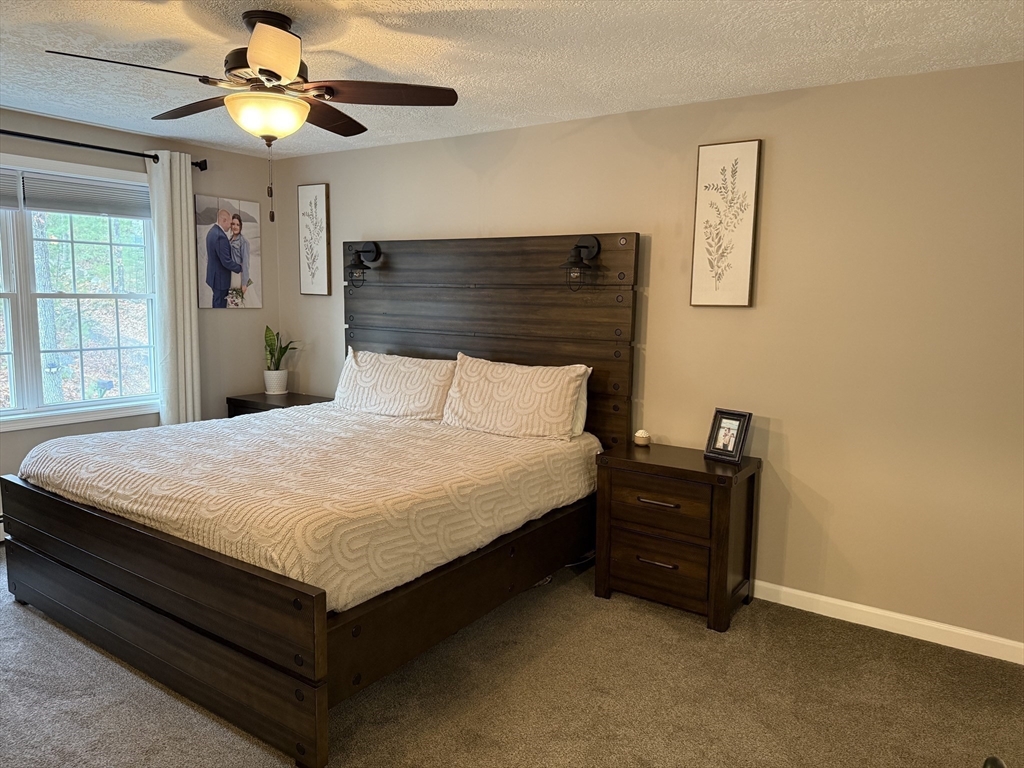 288 Chase Road Athol, MA 01331 - Photo 11 of 24 a bedroom with a bed and a chandelier