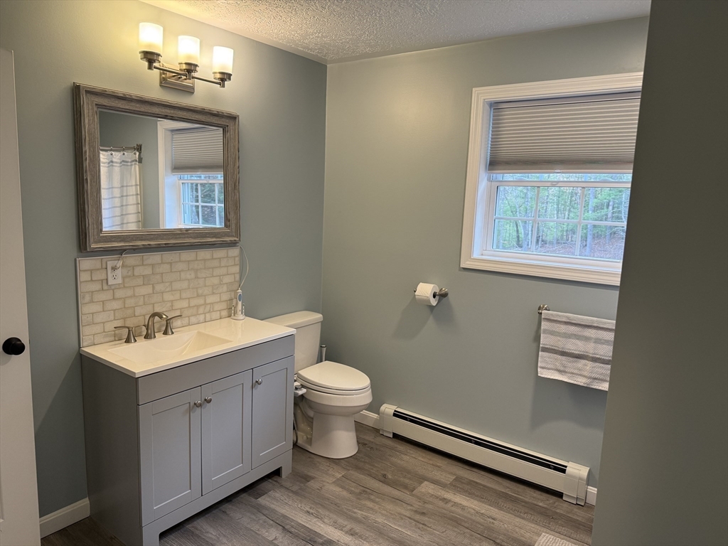 288 Chase Road Athol, MA 01331 - Photo 15 of 24 a bathroom with a toilet sink and mirror