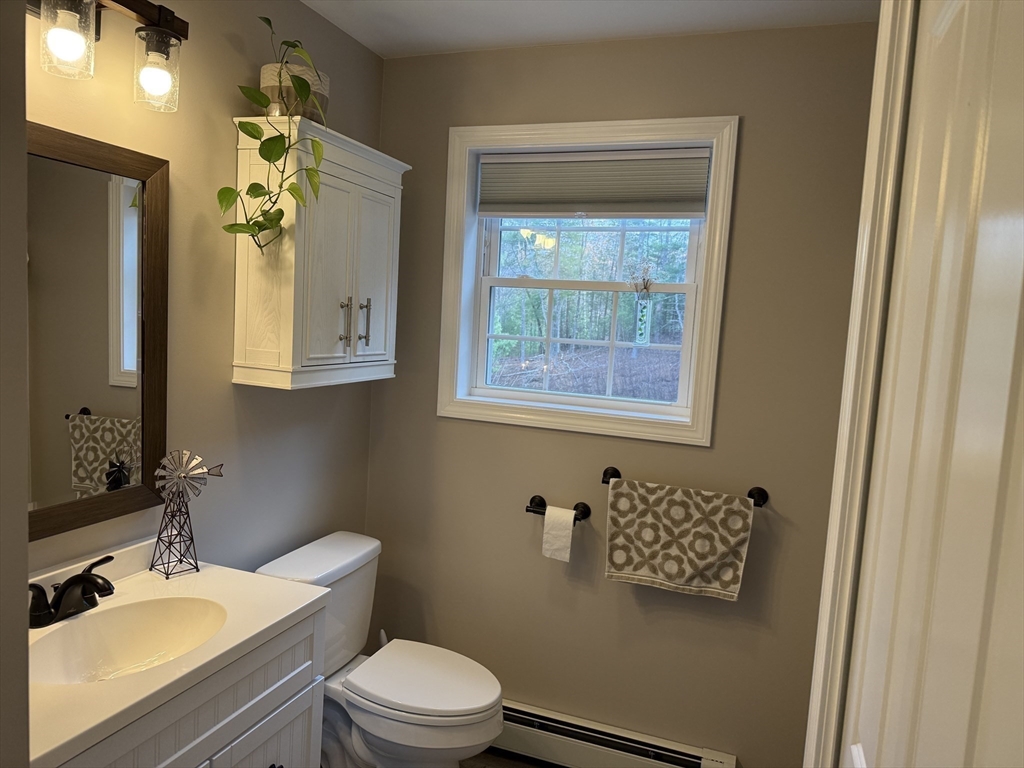 288 Chase Road Athol, MA 01331 - Photo 20 of 24 a bathroom with a toilet a sink and mirror