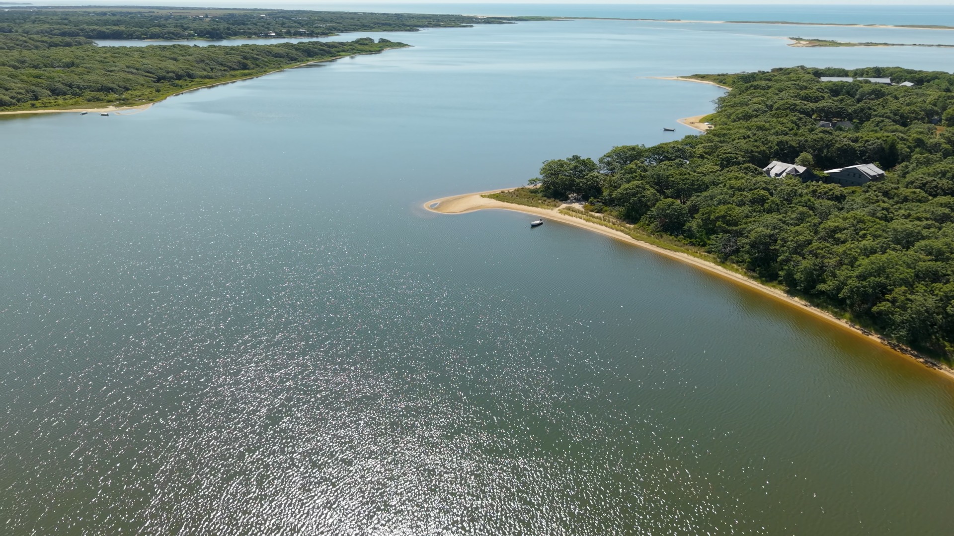 3 Jacob's Neck Road Edgartown, MA 02539 - Photo 9 of 14 a view of a lake from a balcony