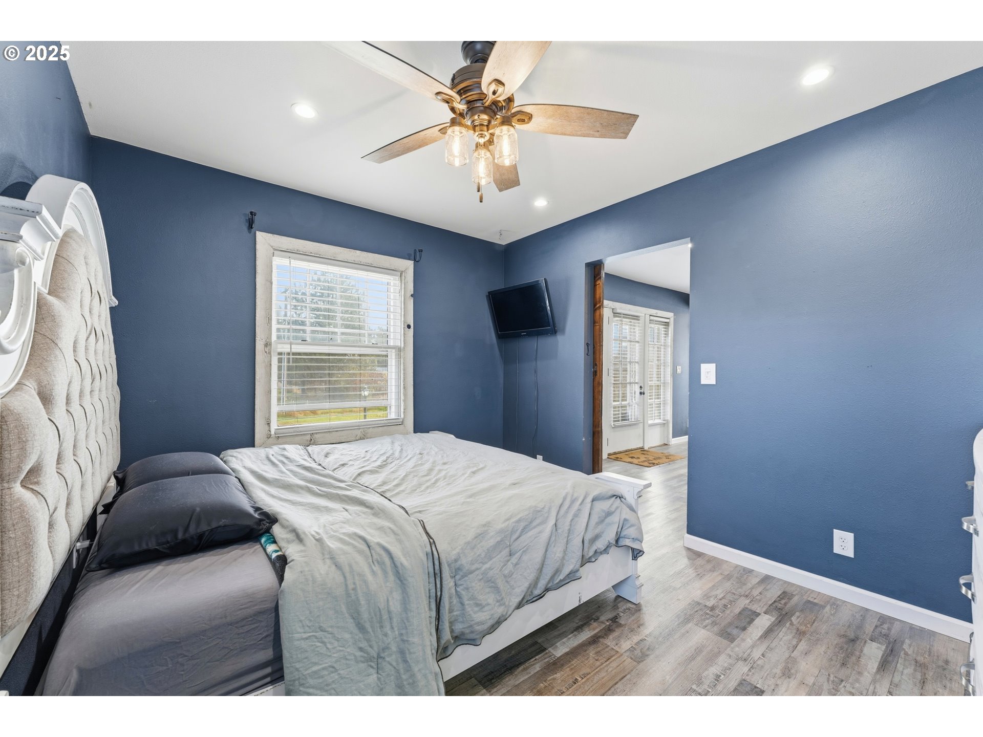 170 Morrison Street Adams, OR 97810 - Photo 15 of 33 a bedroom with a bed and a chandelier