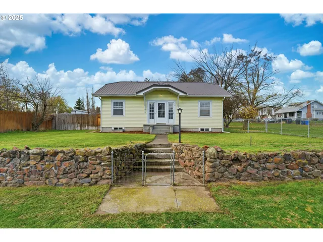 a house with garden in front of it